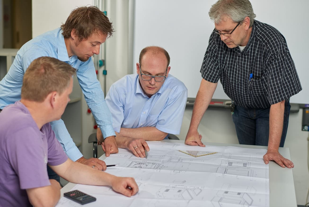 Our technology development team discussing solution designs