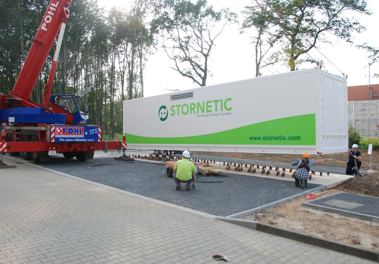 Stornetic container being lowered onto its concrete foundation